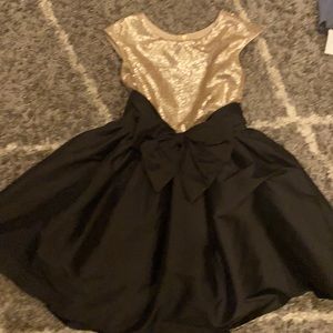 Black and gold formal dress. Worn 1 time to a wedding. In great conduction.
